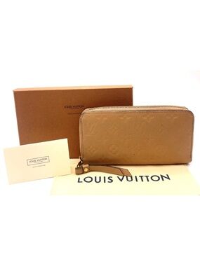 Auth Louis Vuitton Monogram
Empreinte Beige Portefeuille
Clémence